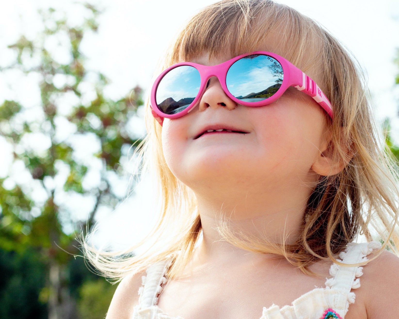 Girl looking at harmful sun light with UV400 protection