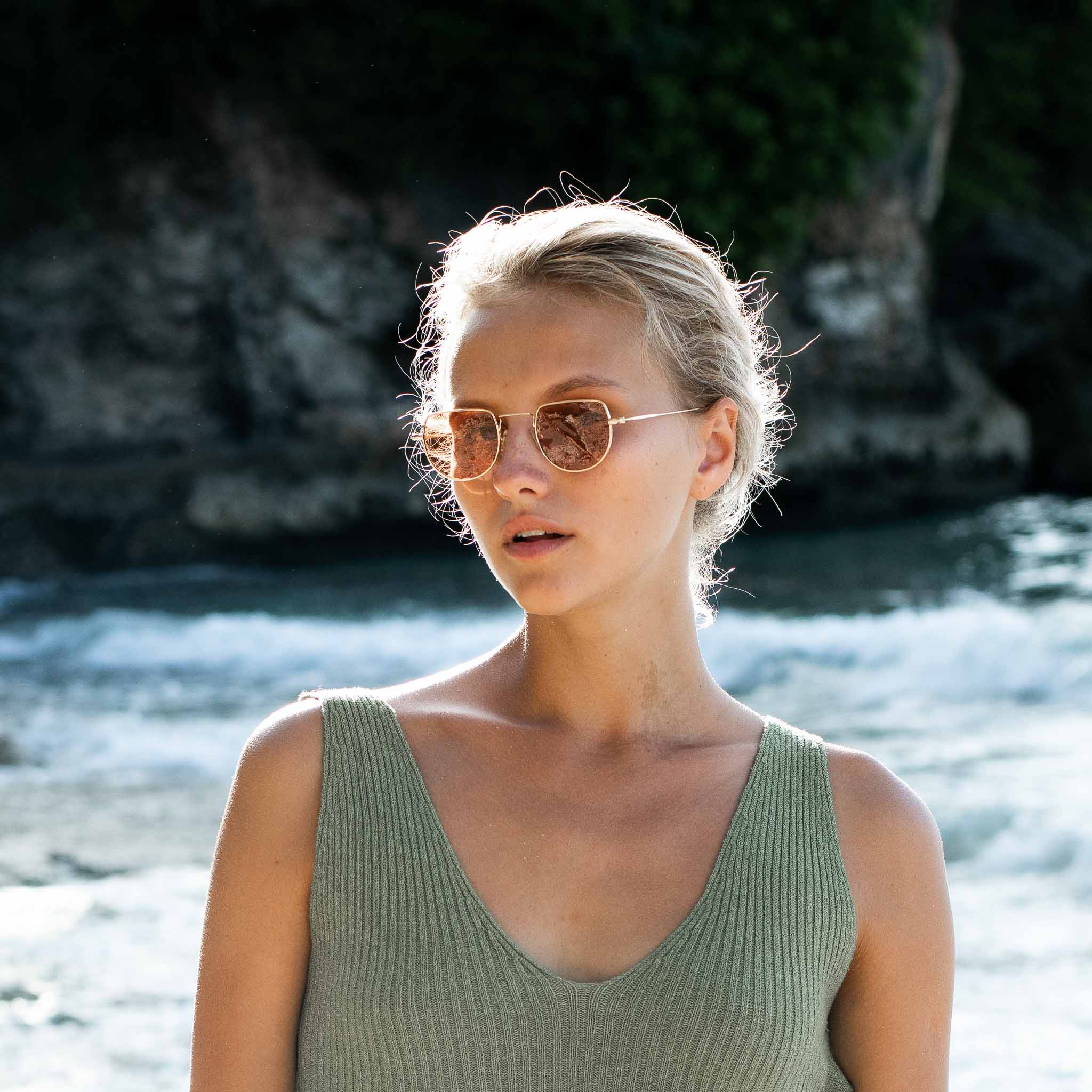 Woman wearing 18k Gold plated Mokki Sunglasses