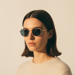 Woman wearing Mokki sunglasses with a plain background