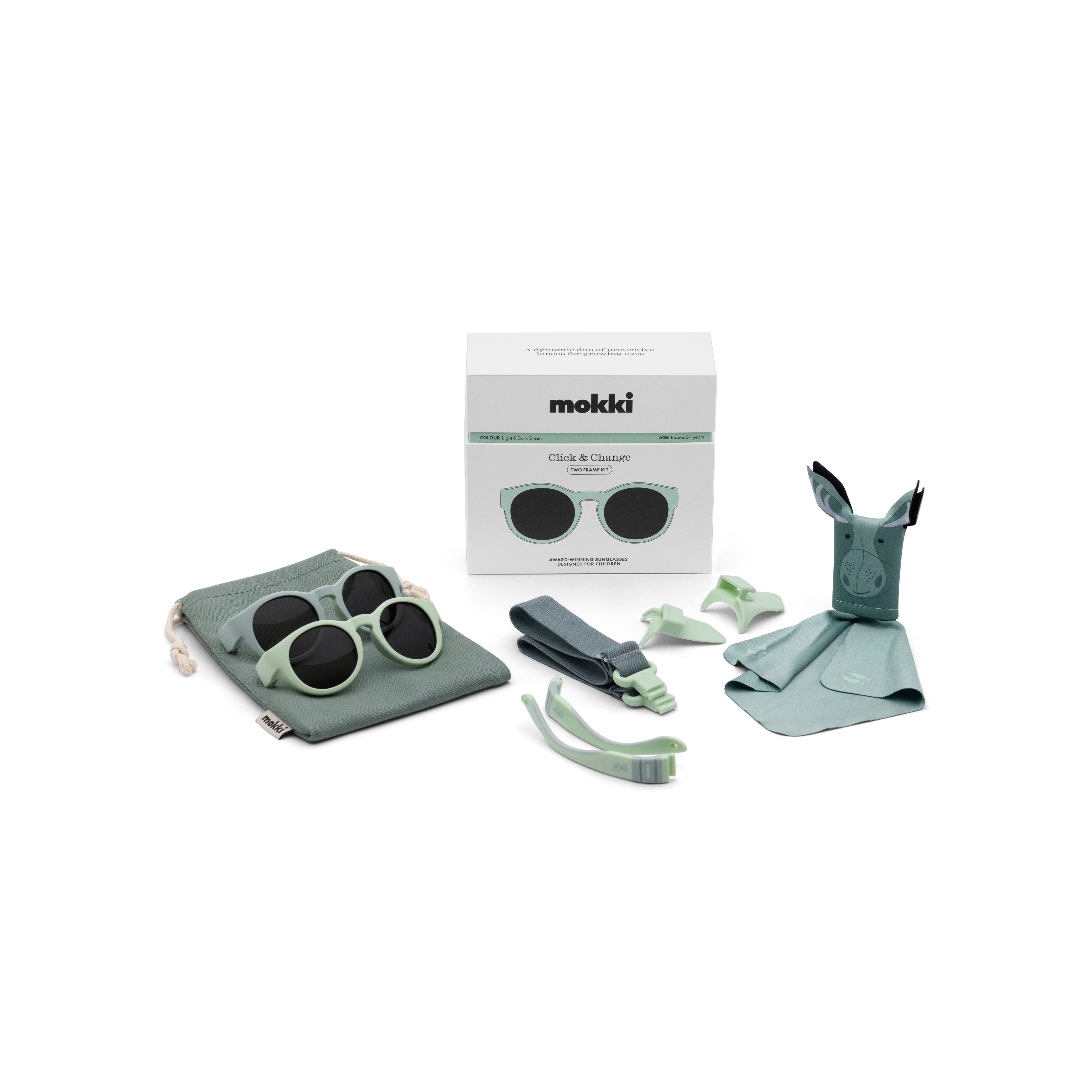 Mokki children's Click & Change sunglasses set with case, cleaning cloth, and box on a white background