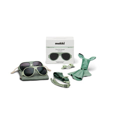 Set of green Click & Change sunglasses with accessories and packaging on a white background