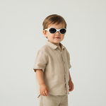 Young boy wearing Classic Baby sunglasses from Mokki