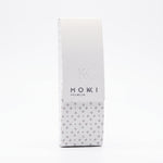 A tall, narrow white rectangular hard case for Mokki Reading glasses,  set against a plain white background.