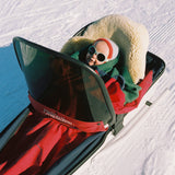 Boy wearing grey Click & Change polarised sunglasses from Mokki in a snowy landscape