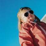 Girl wearing pink Click & Change sunglasses from Mokki