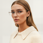 Woman wearing Mokki reading glasses with a plain background