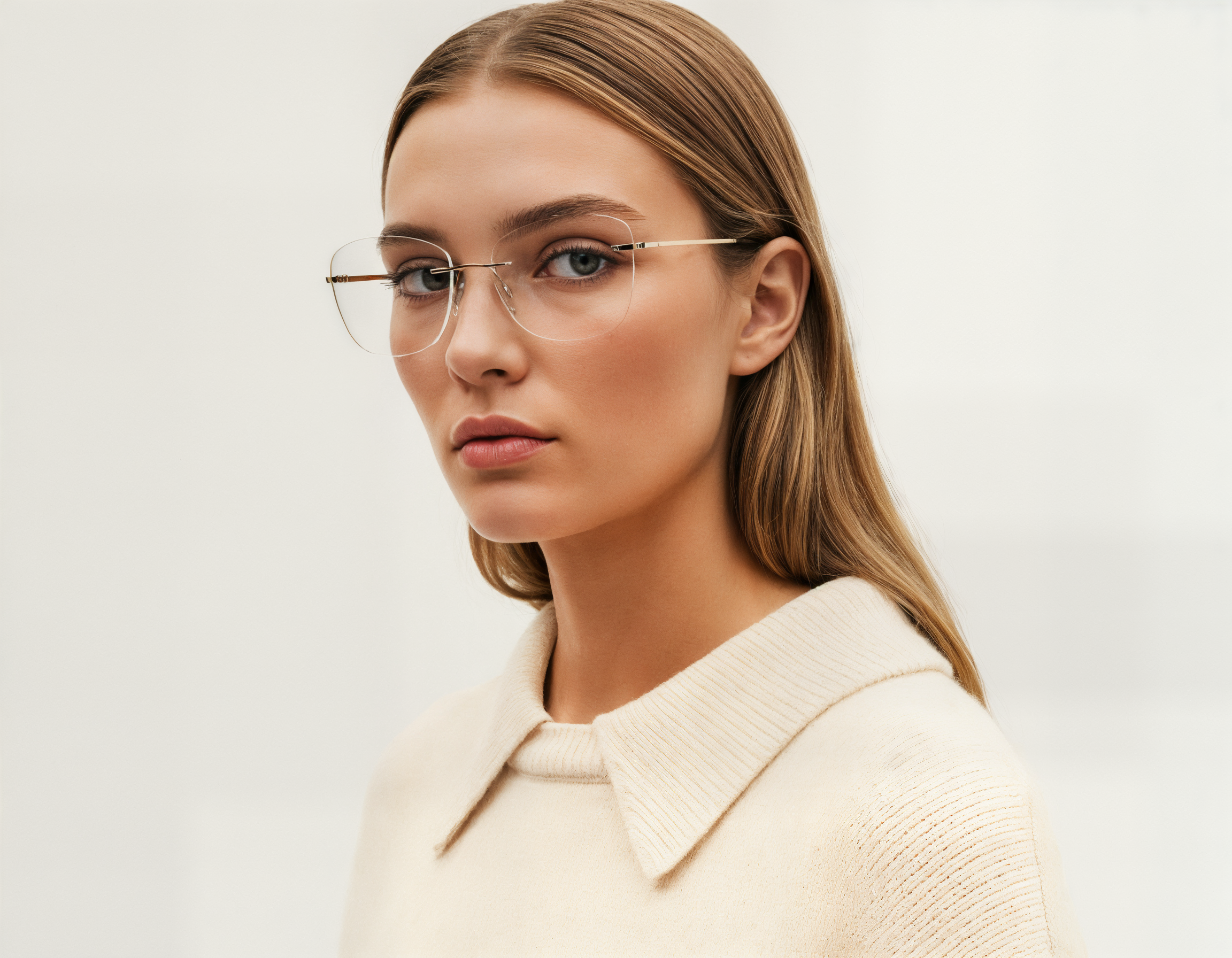Woman wearing Mokki reading glasses with a plain background