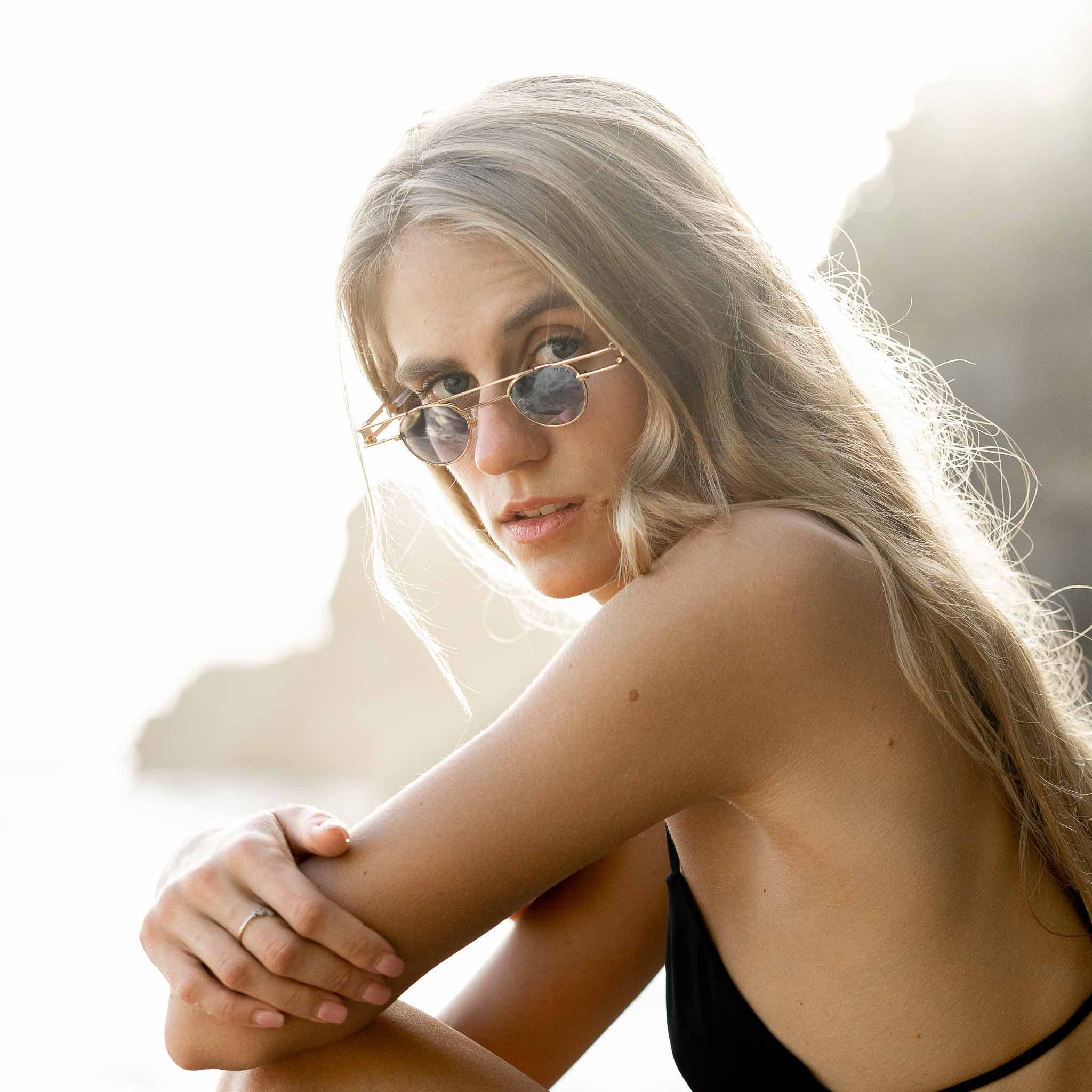 Woman wearing Mokki gold-plated sunglasses