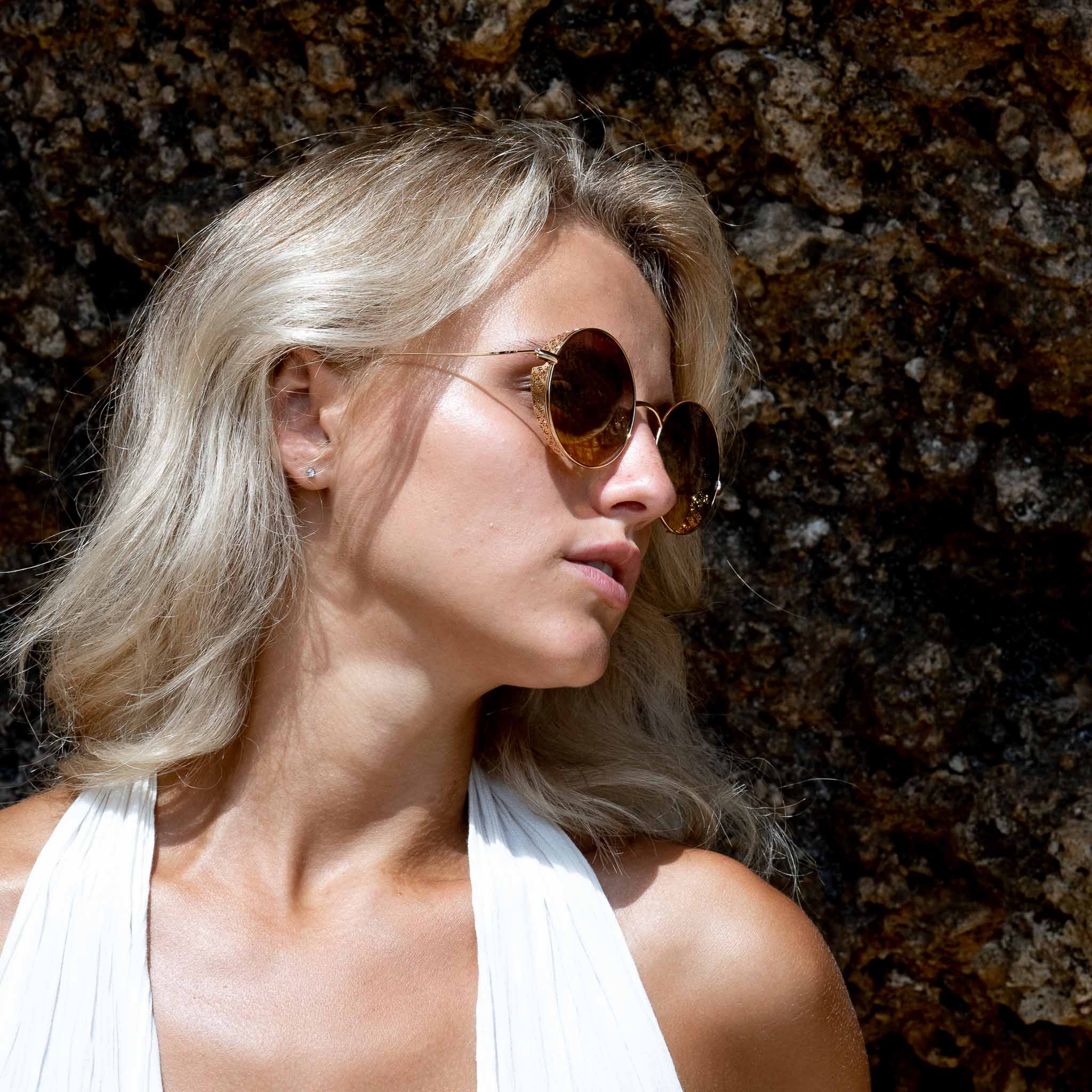 Woman wearing Mokki gold-plated sunglasses
