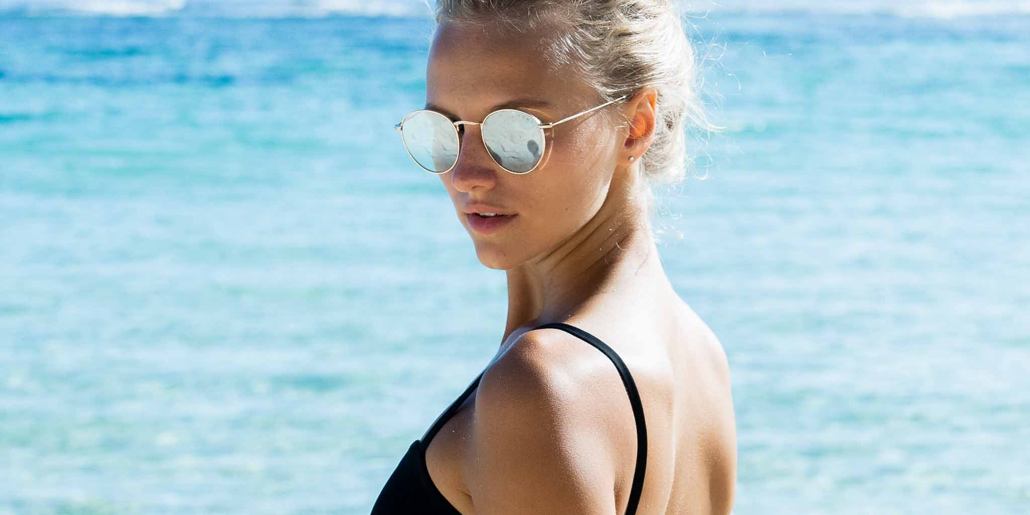 Woman wearing Mokki gold-plated sunglasses