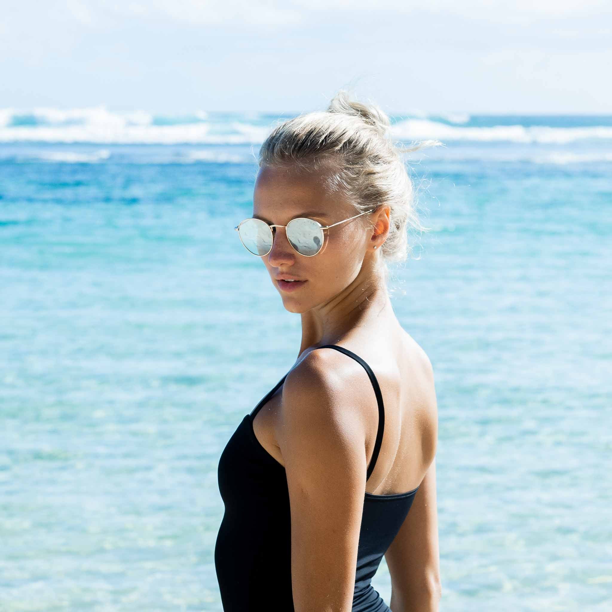 Woman wearing Mokki gold-plated sunglasses