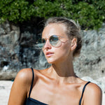 Woman wearing Mokki gold-plated sunglasses