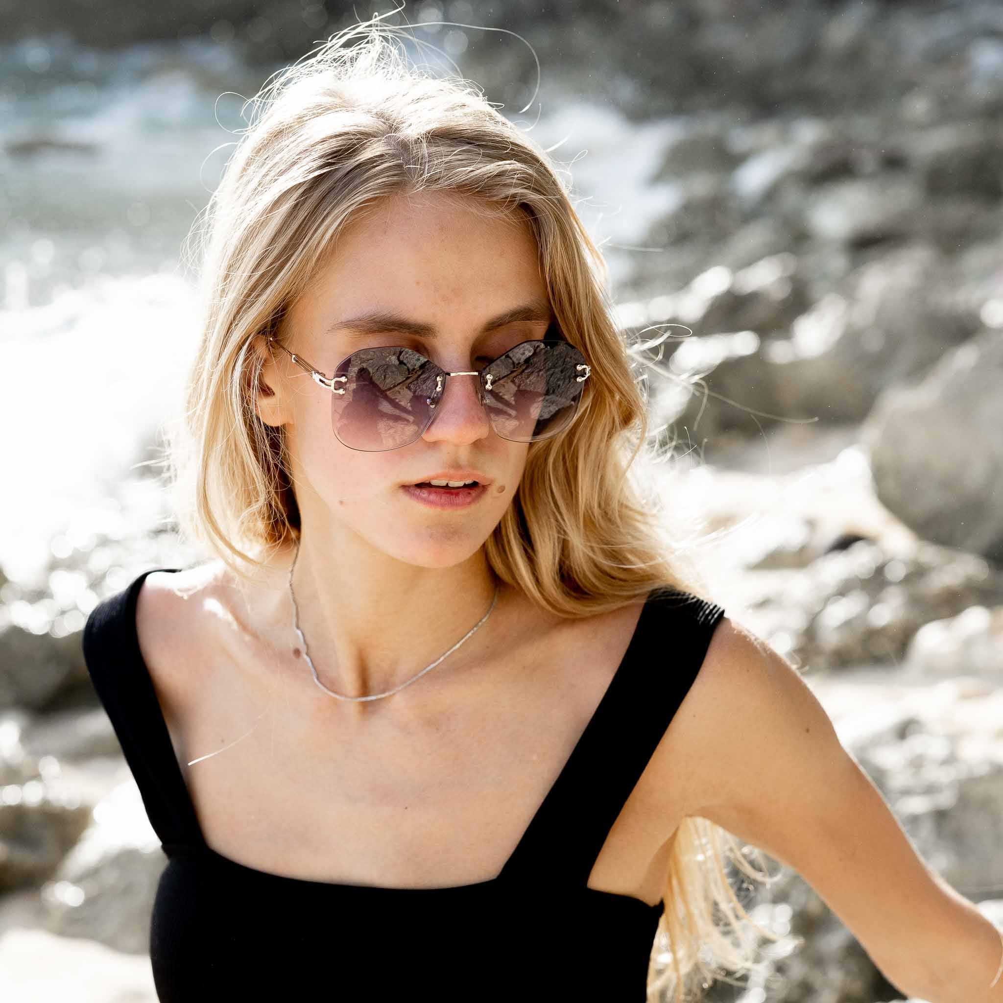 Woman wearing Mokki 90s sunglasses