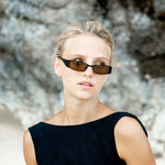 Woman wearing slim Mokki Sunglasses
