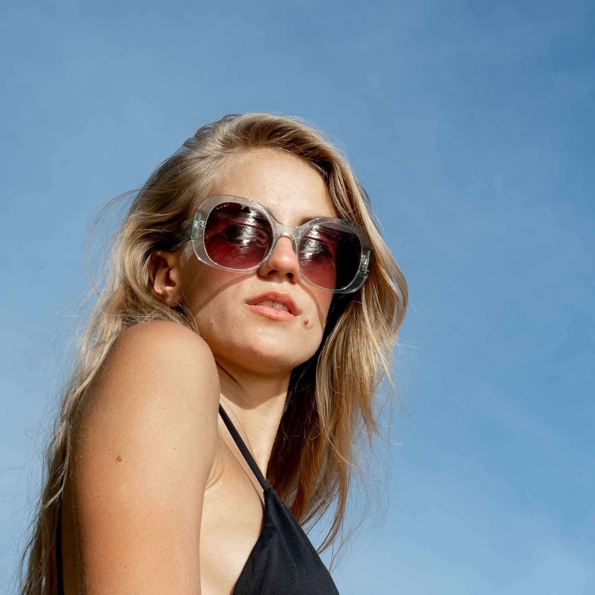 Woman wearing Mokki transparent sunglasses