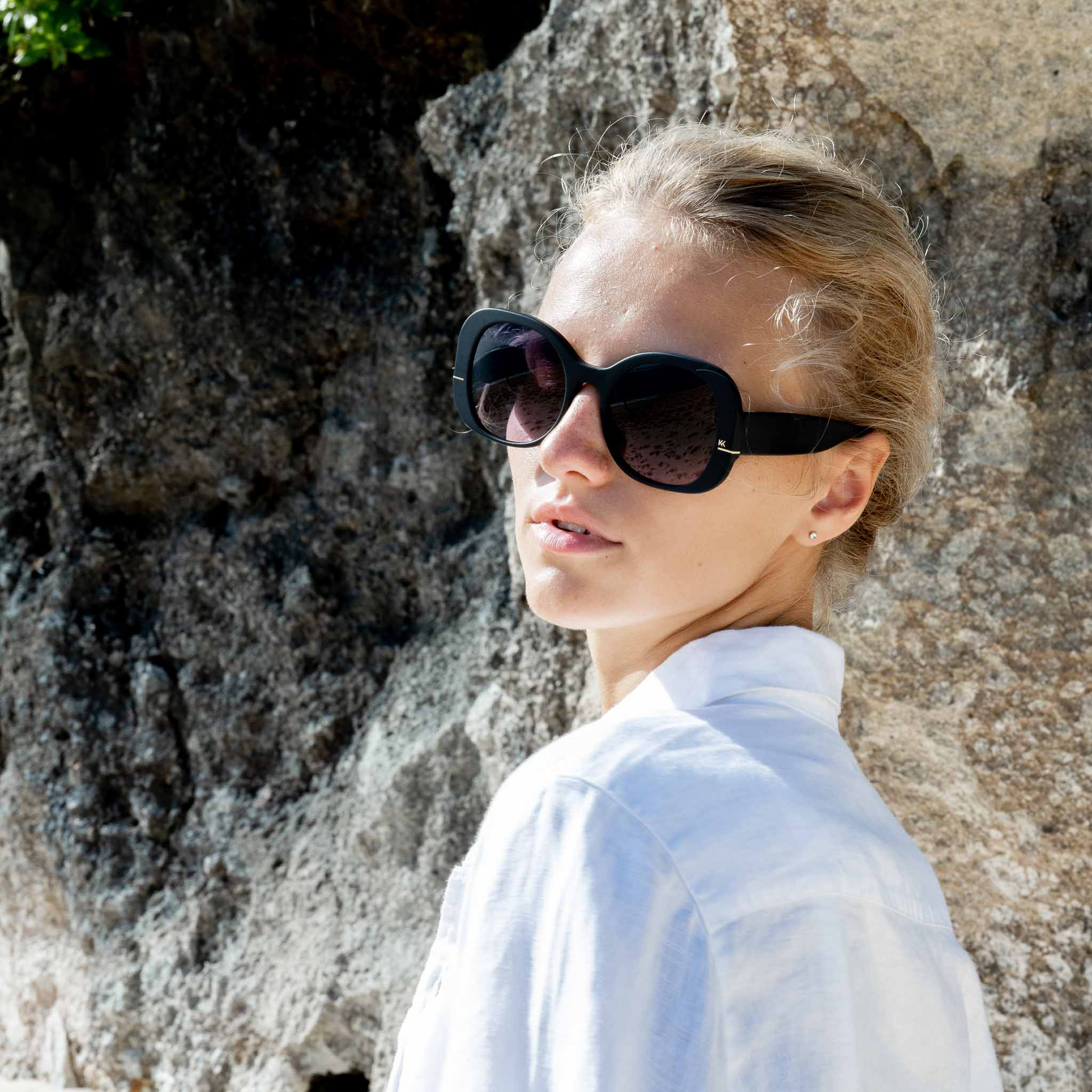 Woman wearing Mokki black sunglasses