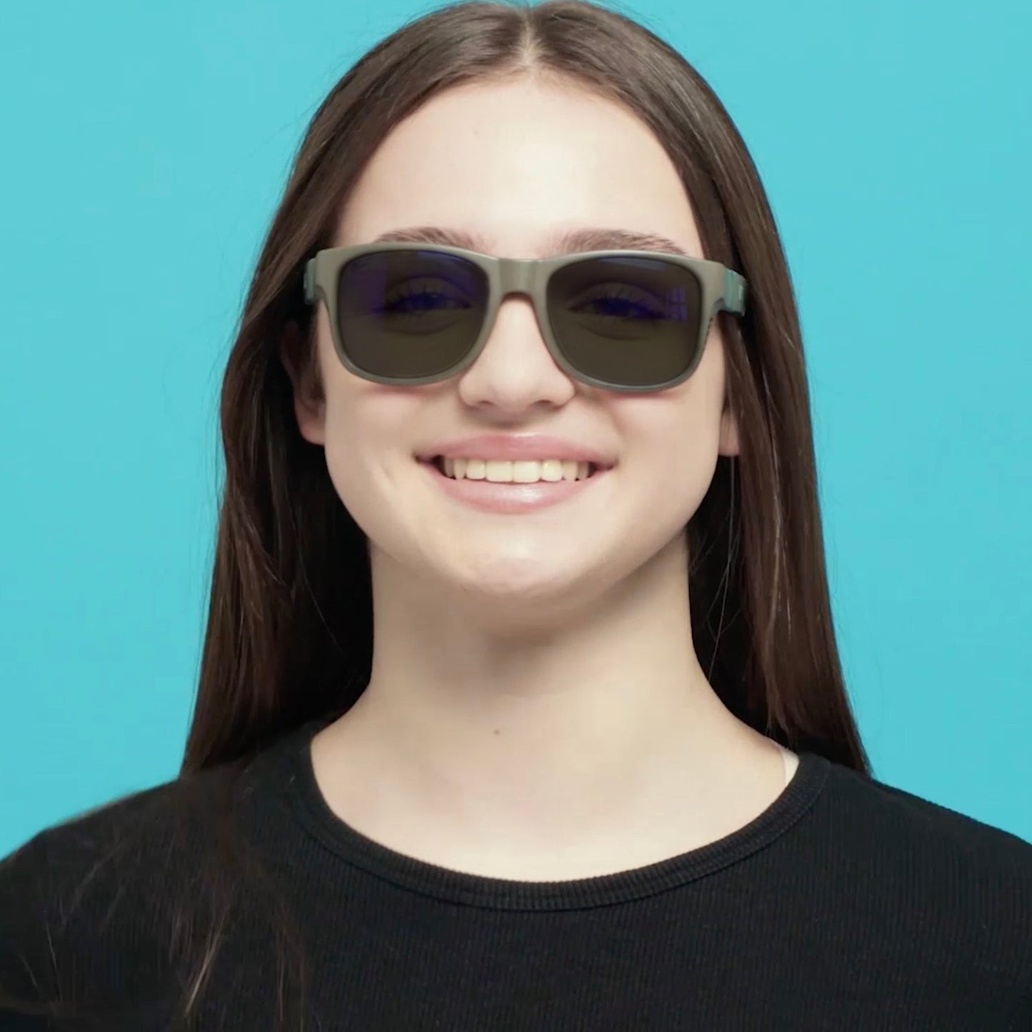 Girl wearing Mokki Click & Change MultiUse Photochromic sunglasses